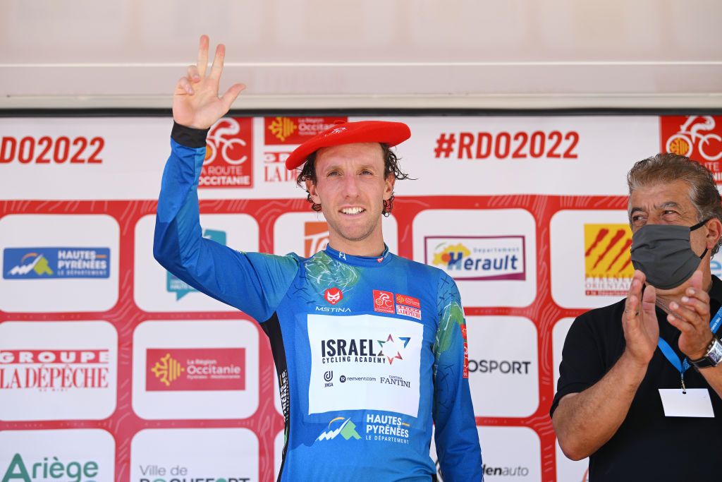 LES ANGLES FRANCE JUNE 18 Michael Woods of Canada and Team Israel Premier Tech celebrates winning the Blue Mountain Jersey on the podium ceremony after the 46th La Route dOccitanie La Depeche du Midi 2022 Stage 3 a 1887km stage from Sigean to Les Angles 1841m RDO2022 on June 18 2022 in Les Angles France Photo by Dario BelingheriGetty Images