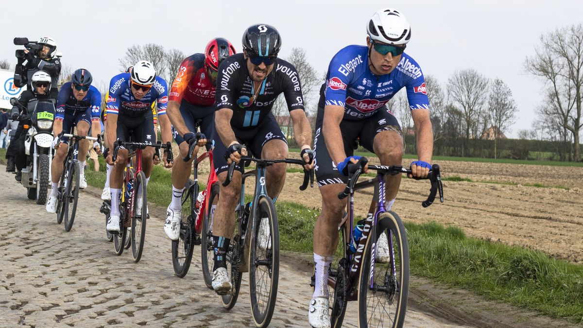 Jasper Philipsen of Belgium and Team Alpecin-Deceuninck, John Degenkolb of Germany and Team DSM and Mathieu Van Der Poel of The Netherlands and Team Alpecin-Deceuninck compete ahead of the Paris-Roubaix 2024