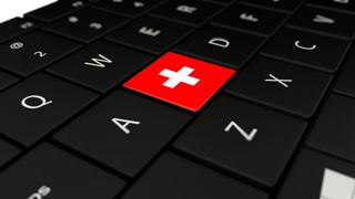 3D rendering close up of Switzerland flag button on laptop keyboard.