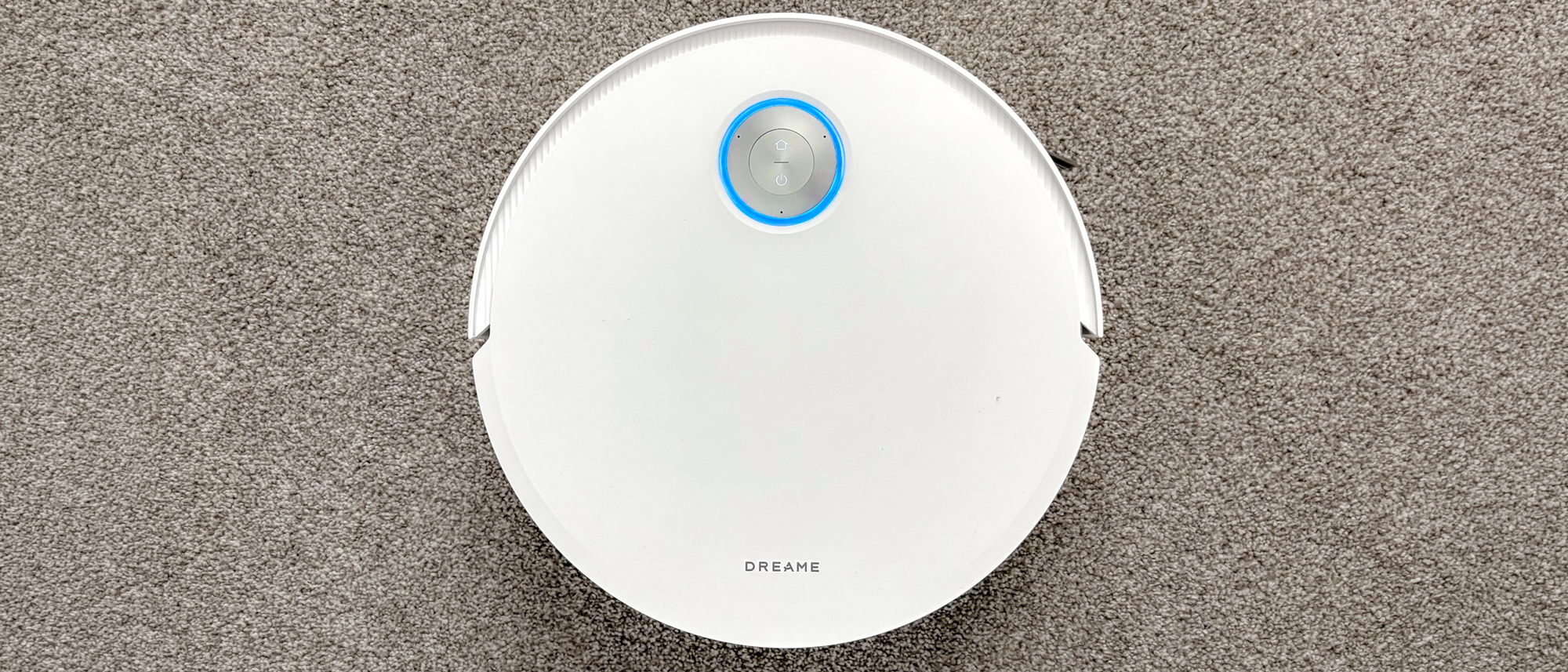 Dreame X60 Max Ultra Complete in white photographed on gray carpet.