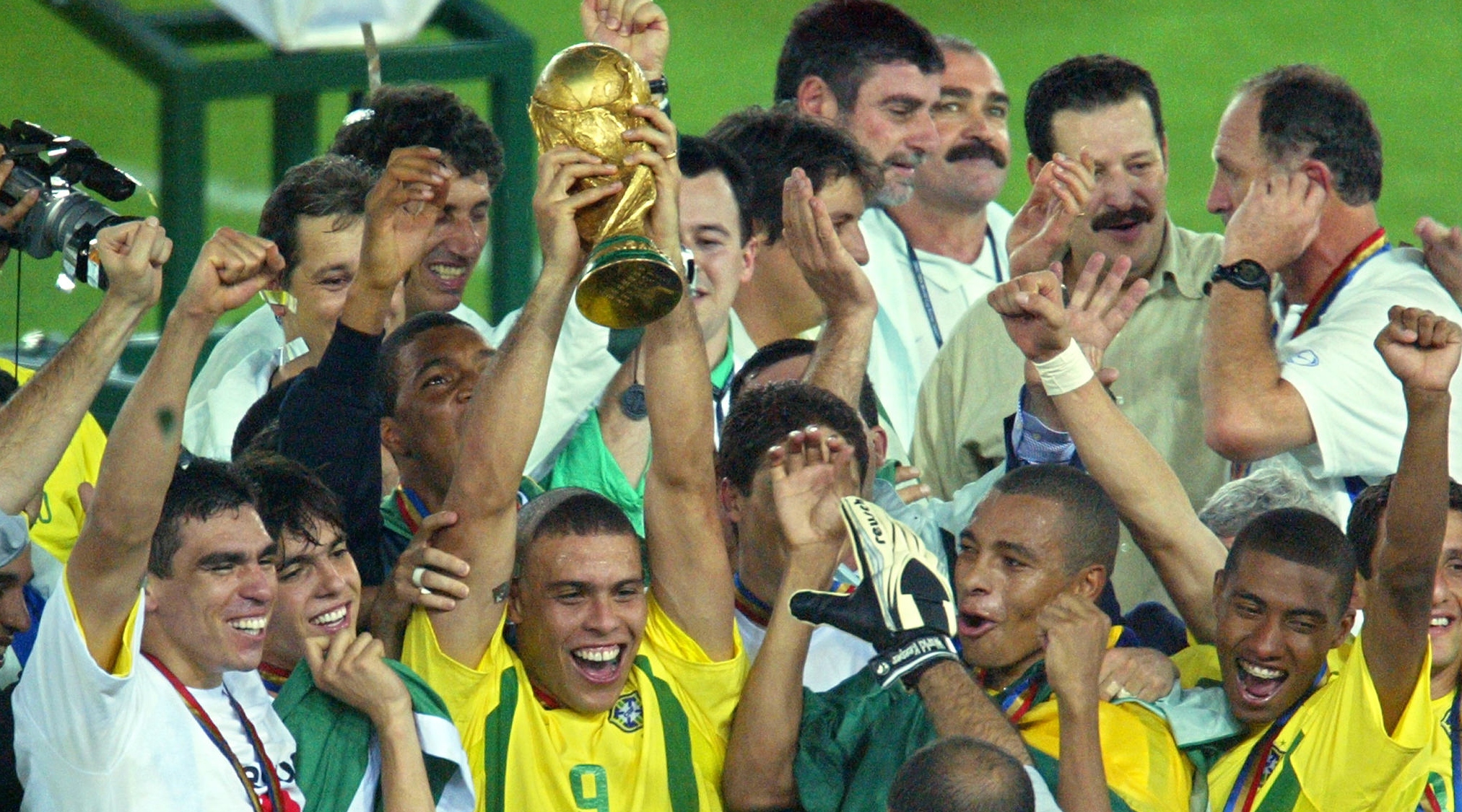 Brazil's forward Ronaldo (C), flanked by teammates, hoists the World Cup trophy during the award ceremony at the International Stadium Yokohama, Japan, on June 30 2002 following Brazil's 2-0 victory against Germany in the 2002 World Cup final