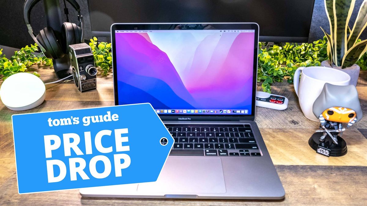 MacBook Pro M2 shown on desk next to plants