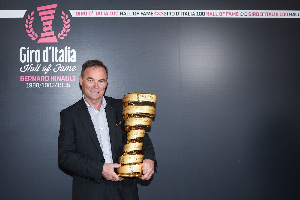 Bernard Hinault poses with the Giro d'Italia trophy