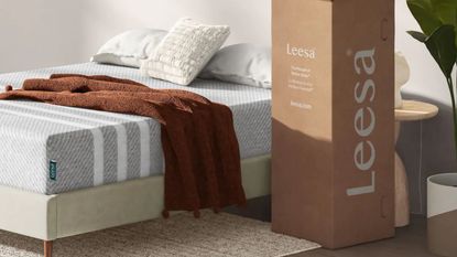 Black Friday Leesa mattress deal on bed with brown throw on