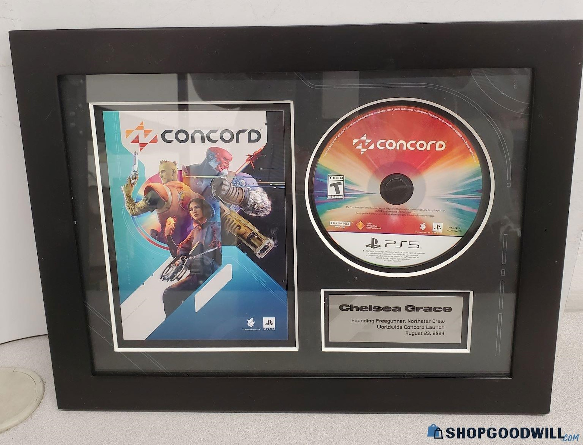 Photo of Concord commemorative wall plaque being auctioned by Goodwill