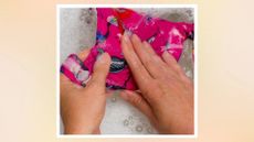 Hands washing a swimsuit to illustrate how often should you wash swimwear