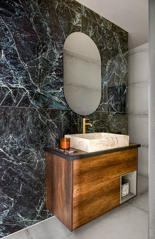 marble bathroom with freestanding vanity