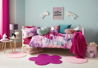 bedroom with single bed unicorn sky blue wall