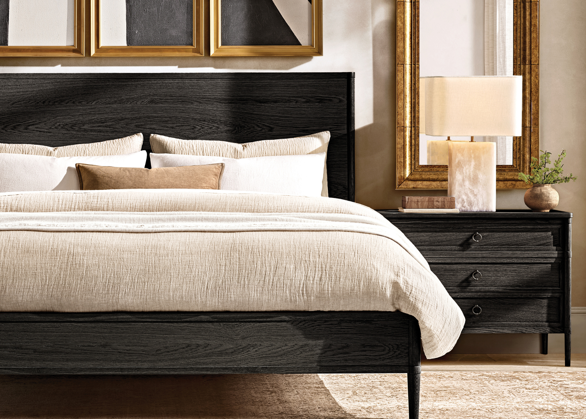 black wooden bed and bedside table in a modern bedroom