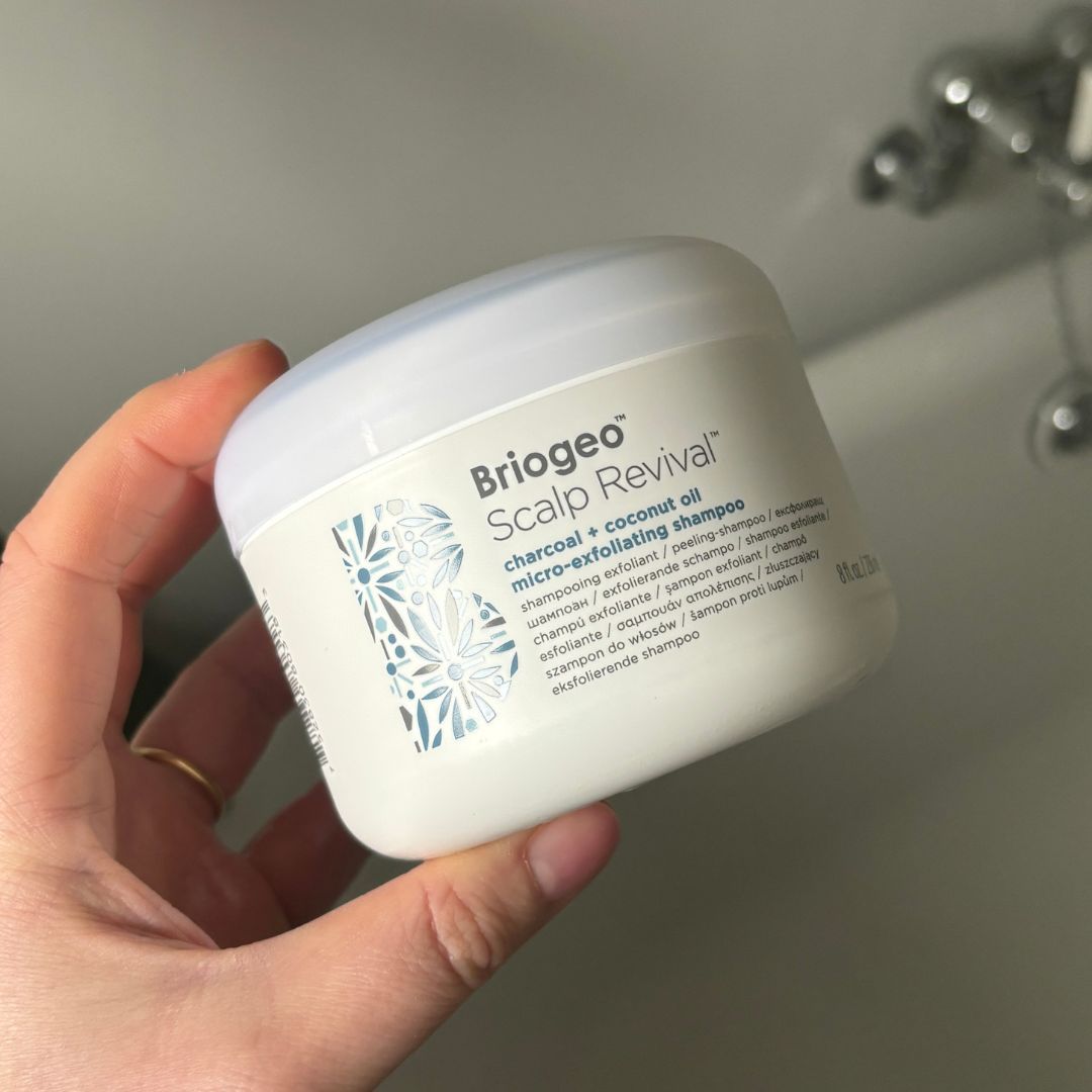 Laura holding Briogeo Scalp Revival&trade; Charcoal + Coconut Oil Micro-Exfoliating Shampoo