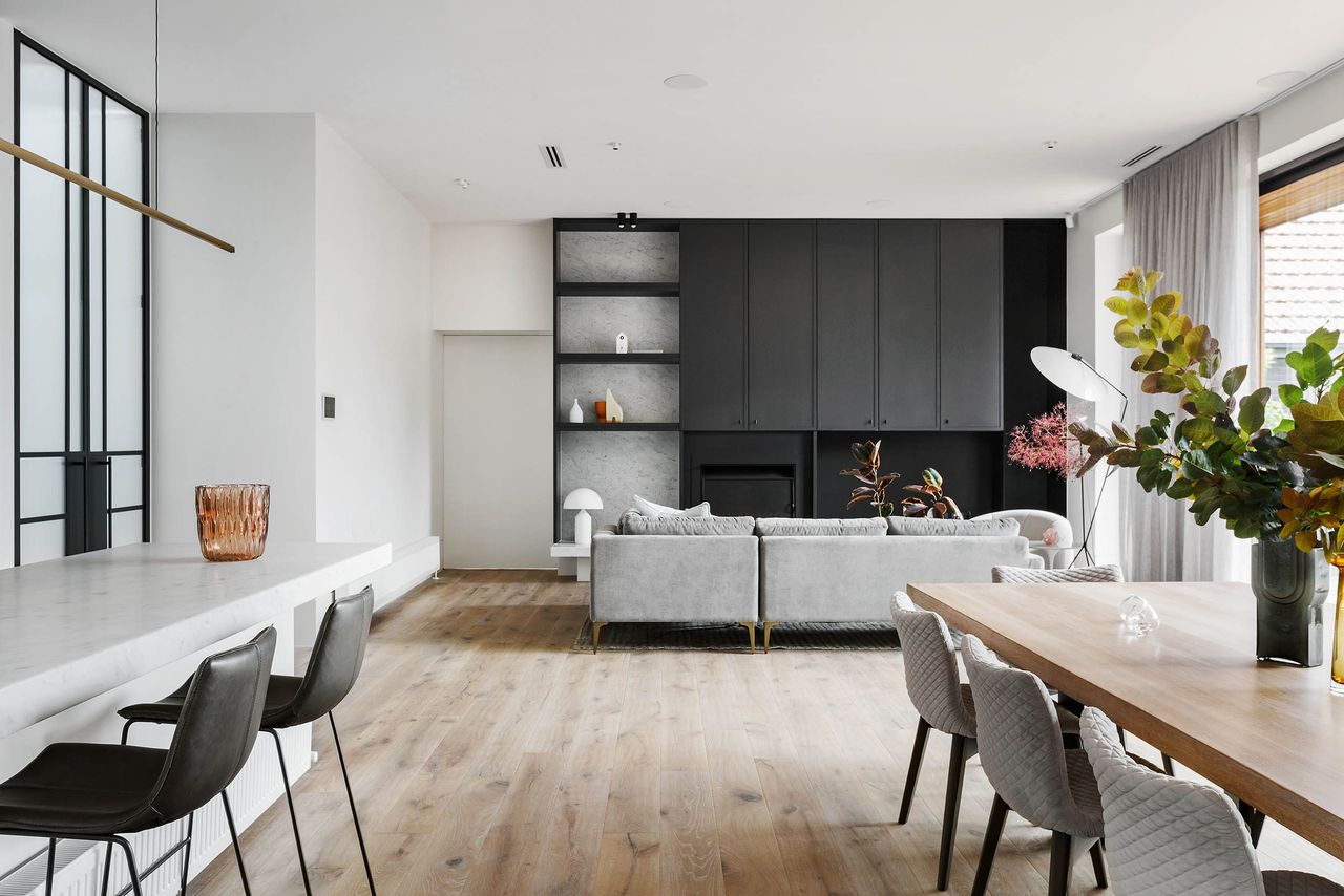 A living room cum dining with laminate flooring