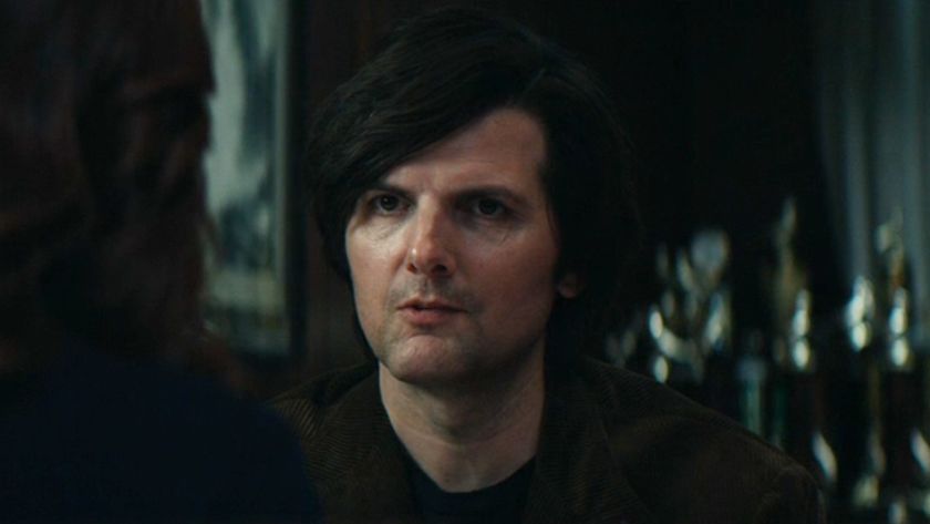 Adam Scott as Mark looking concerned in Severance. 