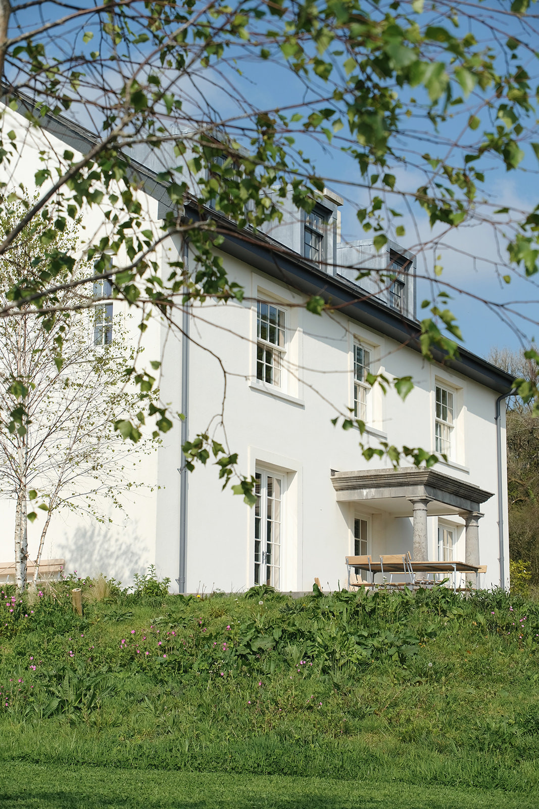 Colour photographs of a retreat-style hotel in the Devon countryside