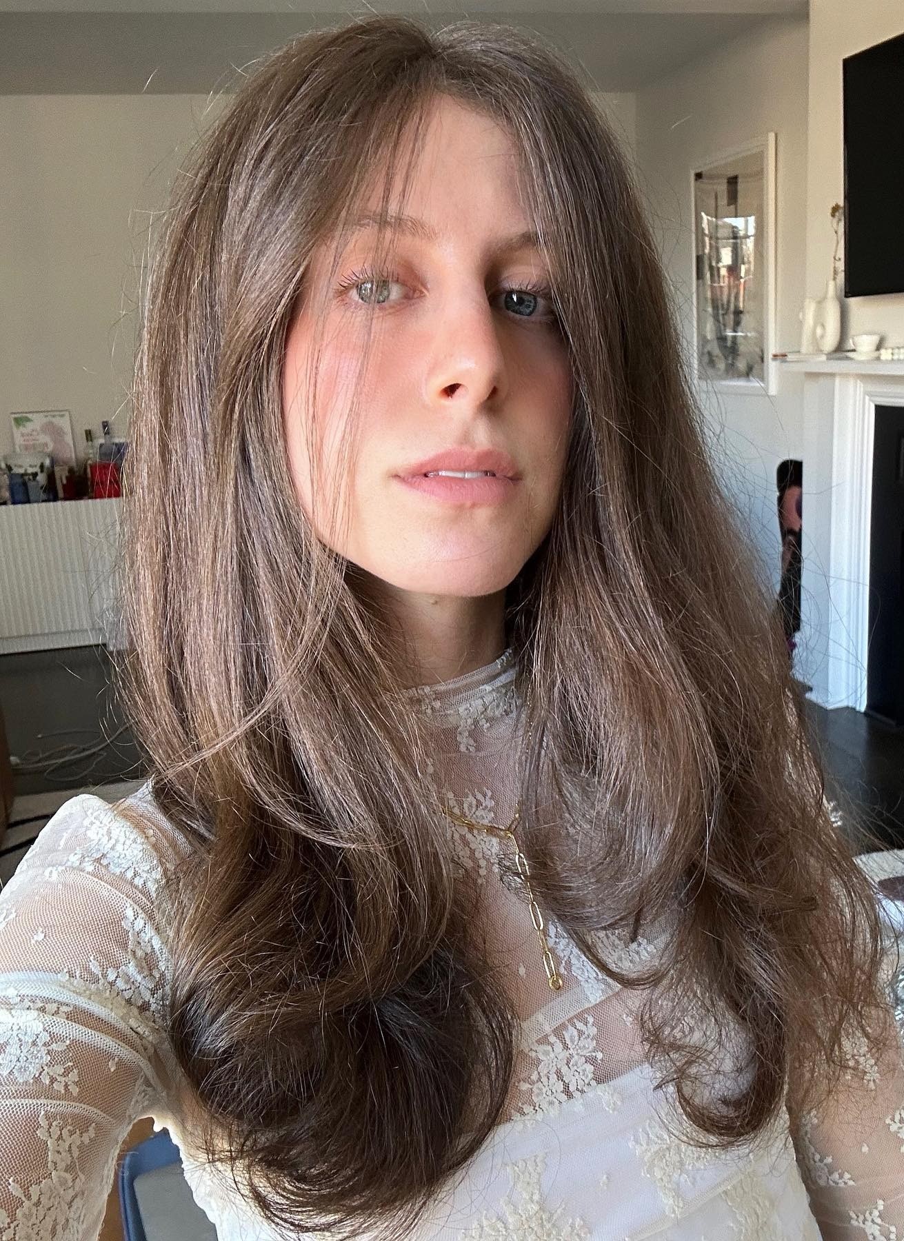 WWW editor Jamie Schneider taking a selfie with a smooth blowout.