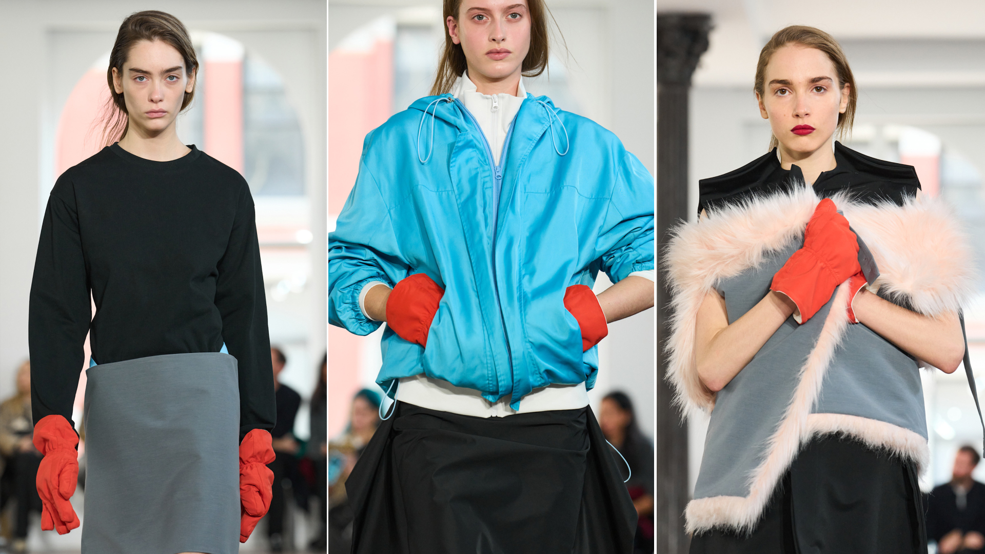 Models at Lii Fall 2026 runway show wearing persimmon red-orange colored gloves with black sweaters, blue windbreaker jackets, and grey and pink fur shawls.