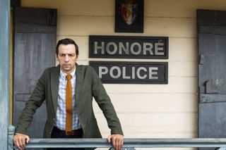 DI Neville Parker outside Honoré police station in Death in Paradise.