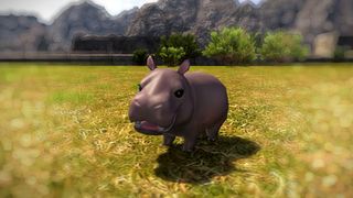 Final Fantasy 14 screenshot showing the Hippo Calf minion, it&#039;s mouth slightly open in a content pose as it stands against a green, grassy backdrop