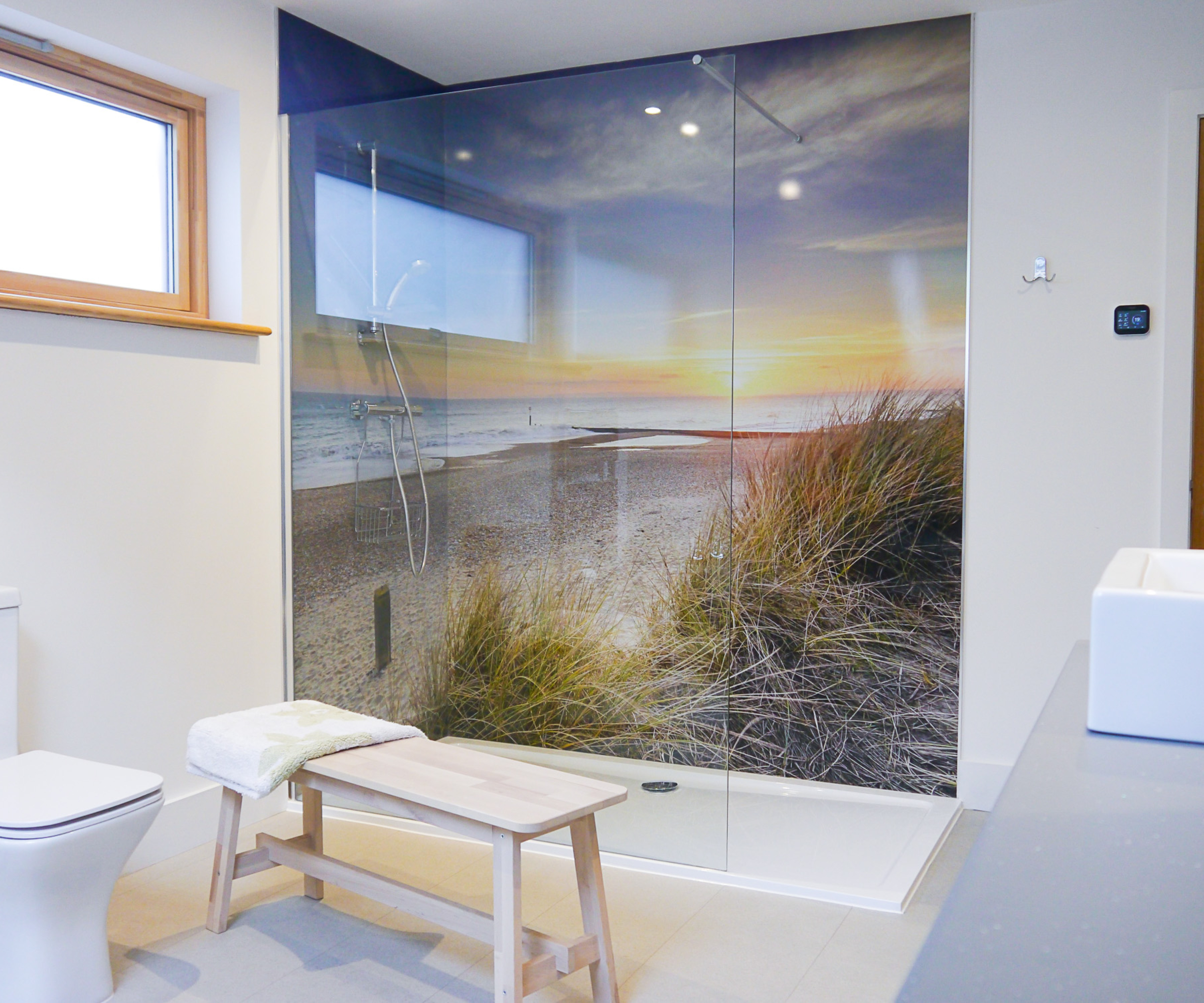 walk in shower with shower panels featuring picture of beach