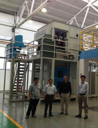 At a height of about two stories high, this may be the world's largest metal 3D printer. At Northwestern Polytechnical University (NPU) in Xi'an, professor Huang Weidong (second from left) has successfully printed precisely shaped titanium airplane parts
