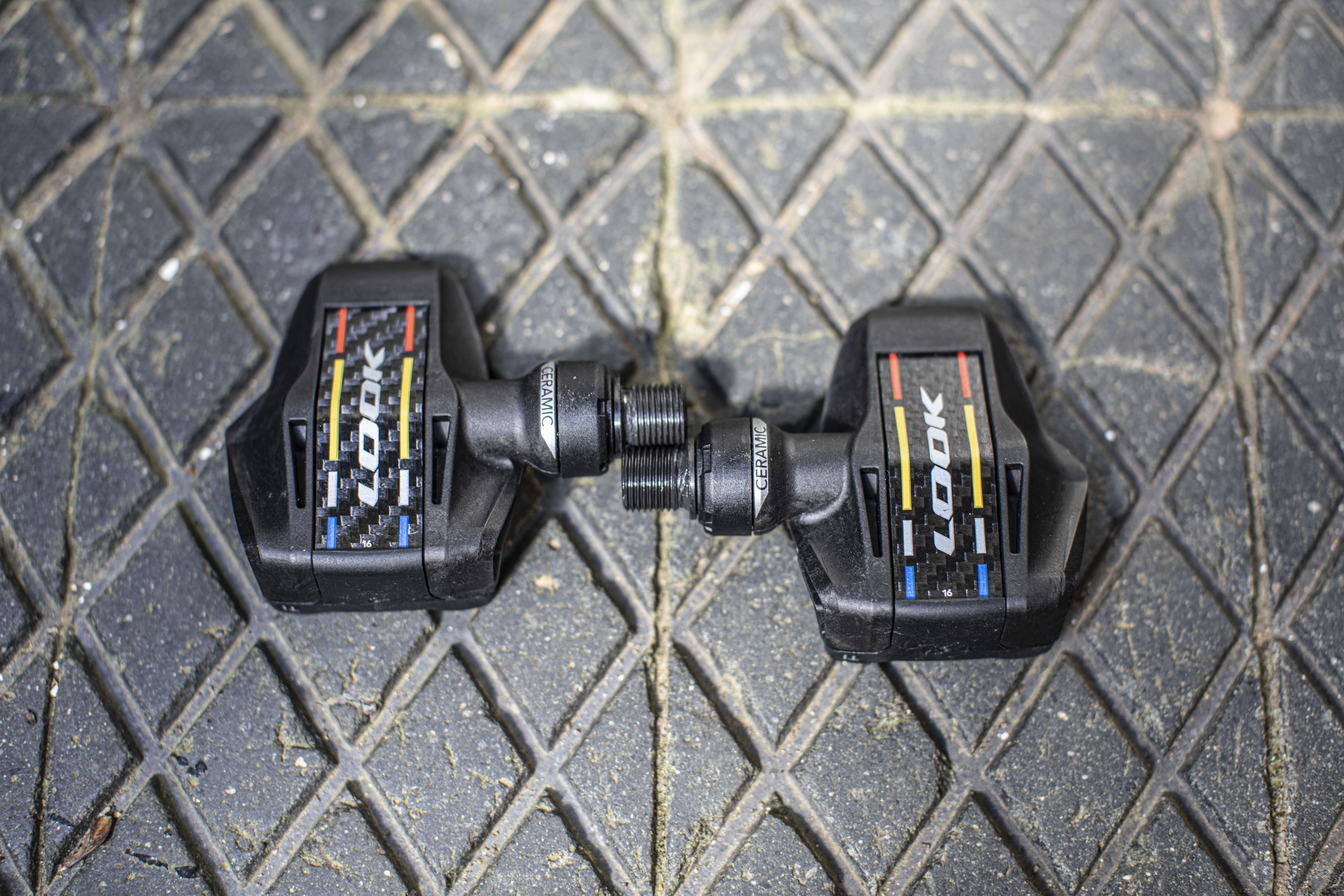 Look Keo Blade Ceramic Ti pedals shown from above on a brick floor