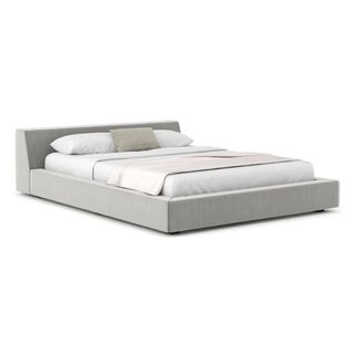A gray upholstered platform bed for the best sustainable furniture brands.
