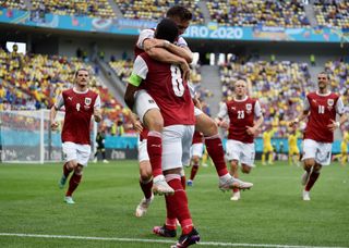 Austria players celebrate a goal against Ukraine at Euro 2020 in Bucharest in June 2021.