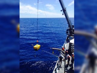 Scientists aboard the R/V Thomas G. Thompson recover a seismometer, part of the Cascadia Initiative, off the coast of Oregon and Washington. This instrument spent a year on the seafloor, recording earthquakes from all over the world.