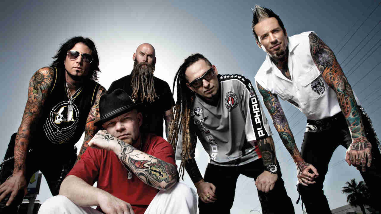 Five Finger Death Punch posing for a photograph in 2013