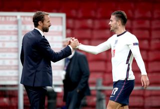 Gareth Southgate (left) shakes hands with Jack Grealish at the end of the match