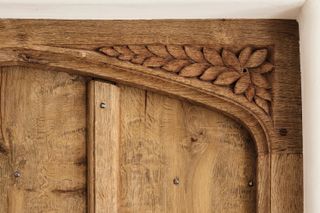 A detail of a carved door at a medieval country house by Jack Badger