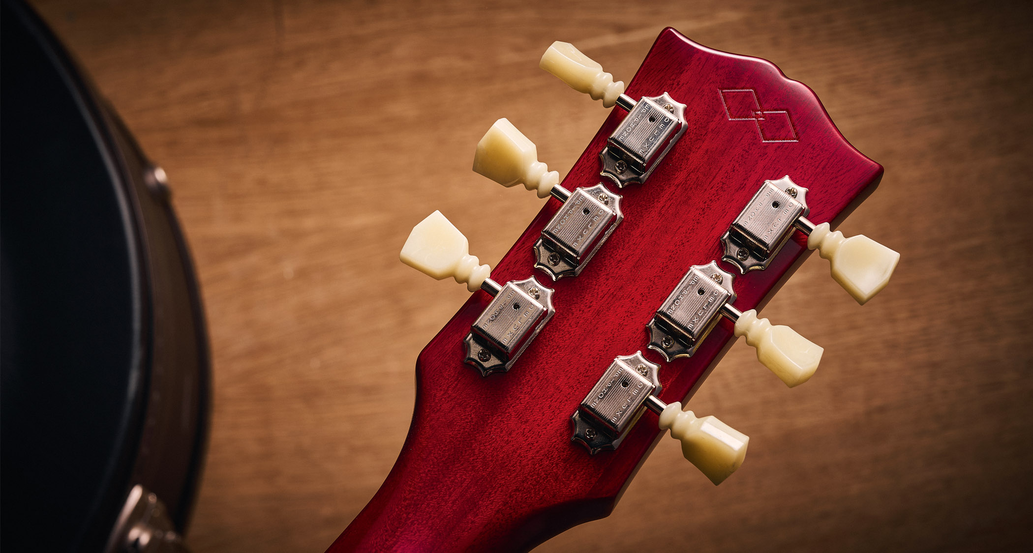 Epiphone Inspired By Gibson Custom 1962 ES-335 Reissue: the handsome semi-hollow electric is finished in Sixties Cherry and is photographed against various backgrounds.