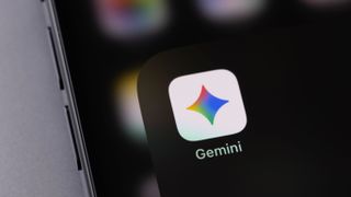 Google Gemini mobile icon app on a screen closeup smartphone iPhone closeup. 
