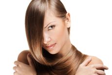 A young woman with shiny, straight hair pulled around her face.