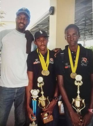 Teniel Campbell returning to Trinidad and Tobago after winning Junior Caribbean Cycling Road Championships 2015 with brother Akil Campbell and Uncle Frank 