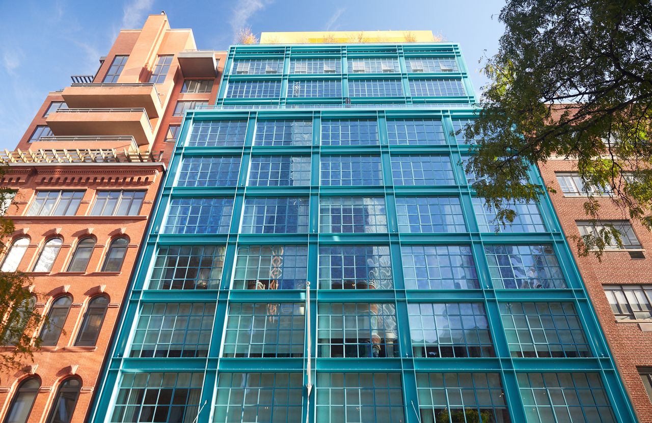 A blue facade and a yellow rooftop