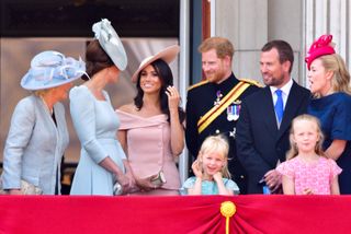 Camilla, Duchess Of Cornwall, Catherine, Duchess of Cambridge, Meghan, Duchess of Sussex, Prince Harry, Duke of Sussex, Peter Phillips, Autumn Phillips, Isla Phillips and Savannah Phillips stand on the balcony of Buckingham Palace during the Trooping the Colour parade on June 9, 2018 in London, England.