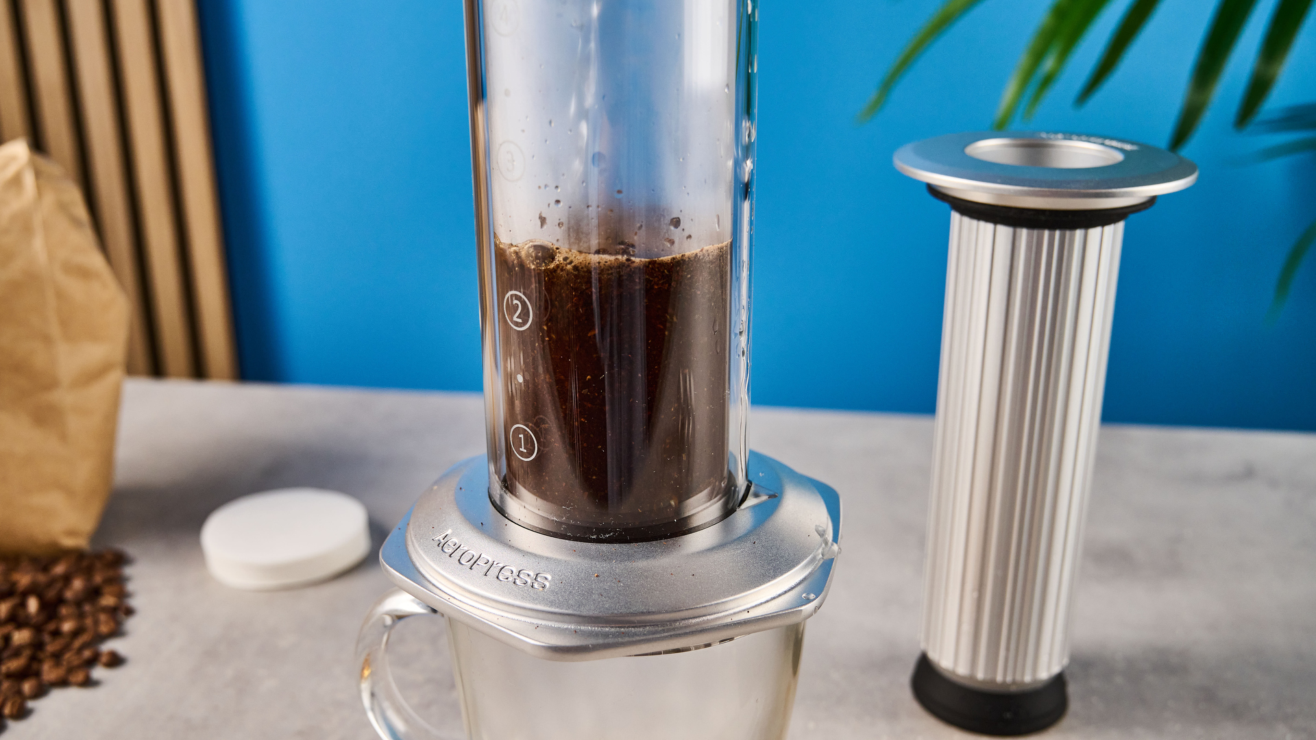 a glass AeroPress premium with aluminum flourishes 