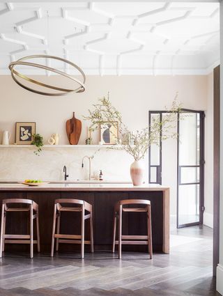 minimalist kitchen with round statement lighting