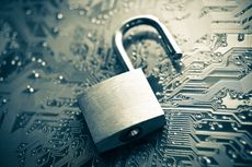 Open padlock on circuit board