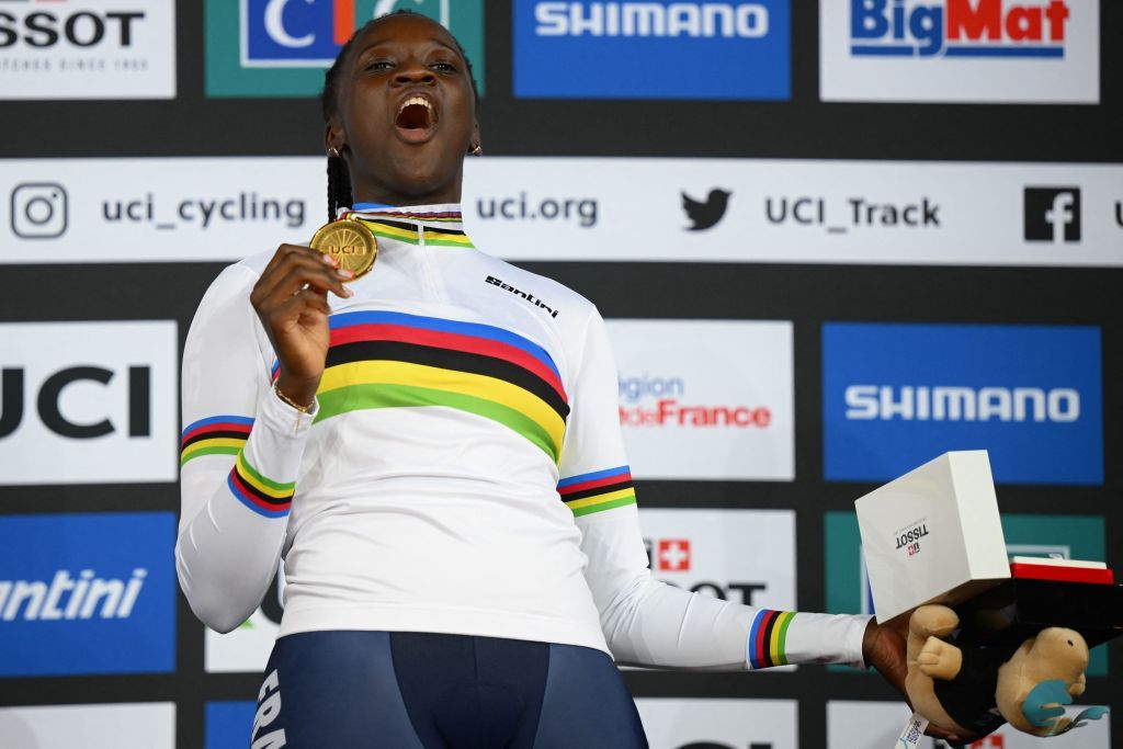 Frances Taky Marie Divine Kouame celebrates on the podium with her gold medal after winning the Womens 500m time trial final during the UCI Track Cycling World Championships at the Velodrome of SaintQuentinenYvelines southwest of Paris on October 15 2022 Photo by AnneChristine POUJOULAT AFP Photo by ANNECHRISTINE POUJOULATAFP via Getty Images