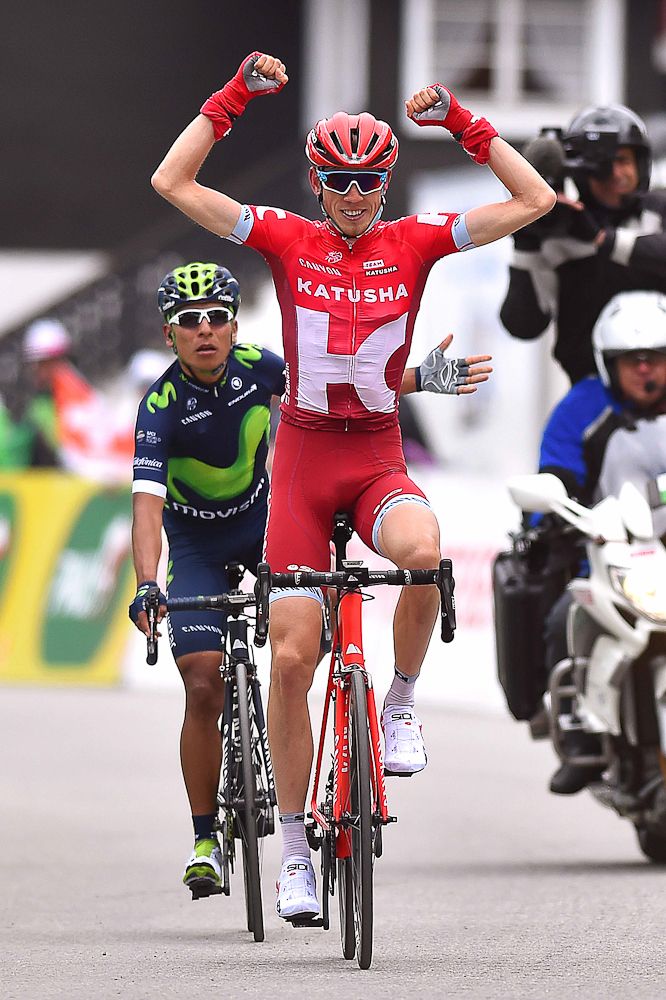 Zakarin celebrates as Quintana sits up at the end of stage 4 at the Tour de Romandie.
