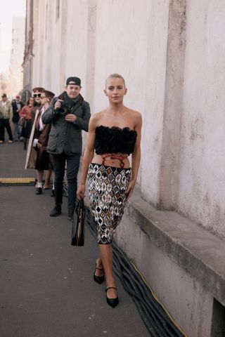 Milan Fashion Week attendees wear satin shoes.