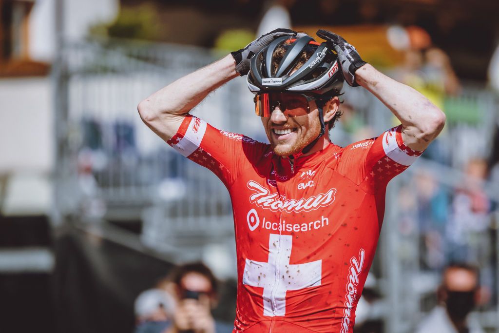 Switzerlands Mathias Flueckiger celebrates his first place of the Mens Cross Country competition of the UCI Mountain Bike World Cup in Leogang Austria on June 13 2021 Austria OUT Photo by JFK various sources AFP Austria OUT Photo by JFKEXPAAFP via Getty Images