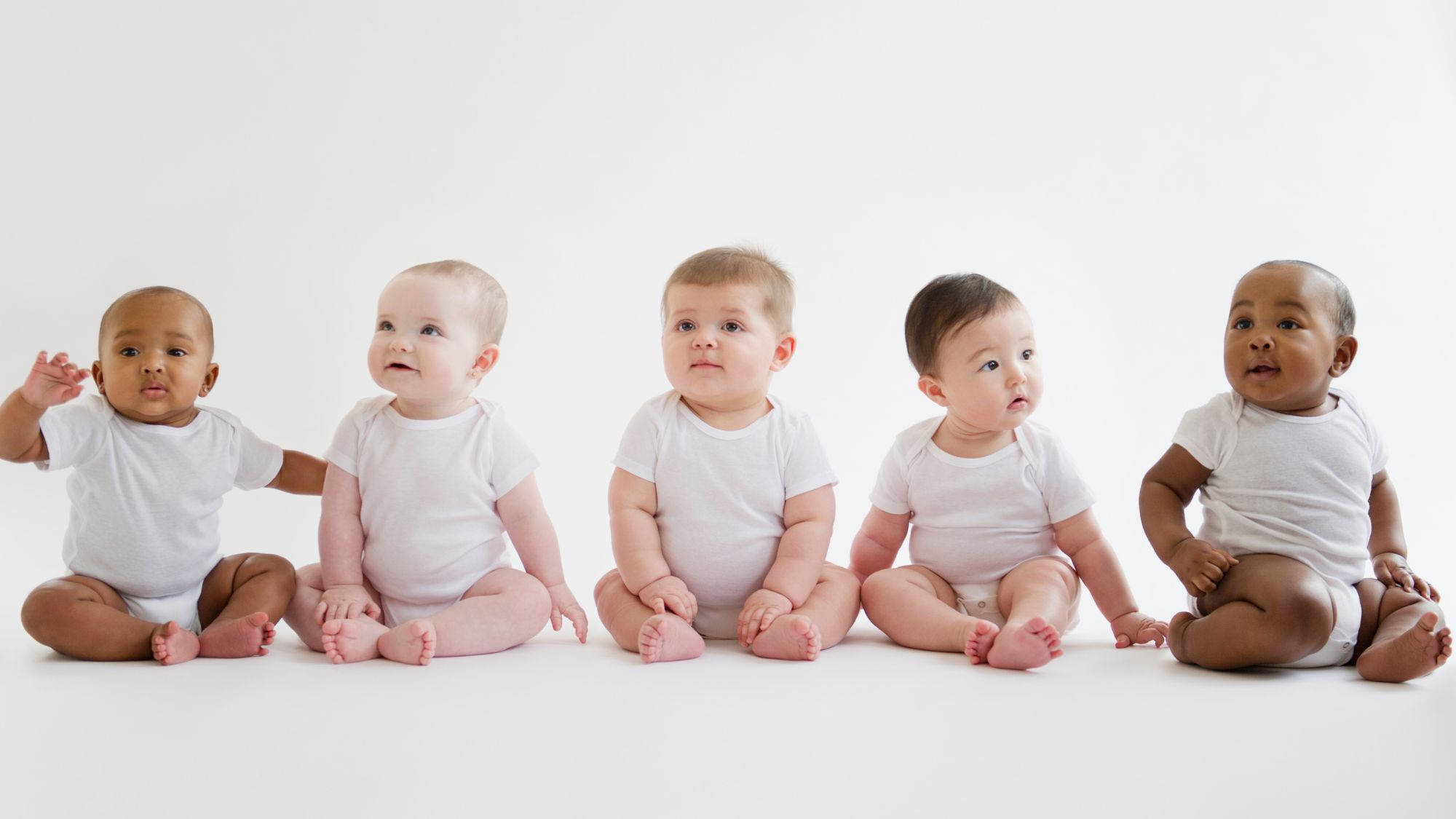 Babies sit on the floor together