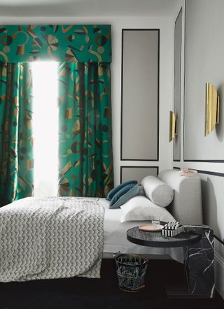 a modern bedroom with colorful patterned curtains
