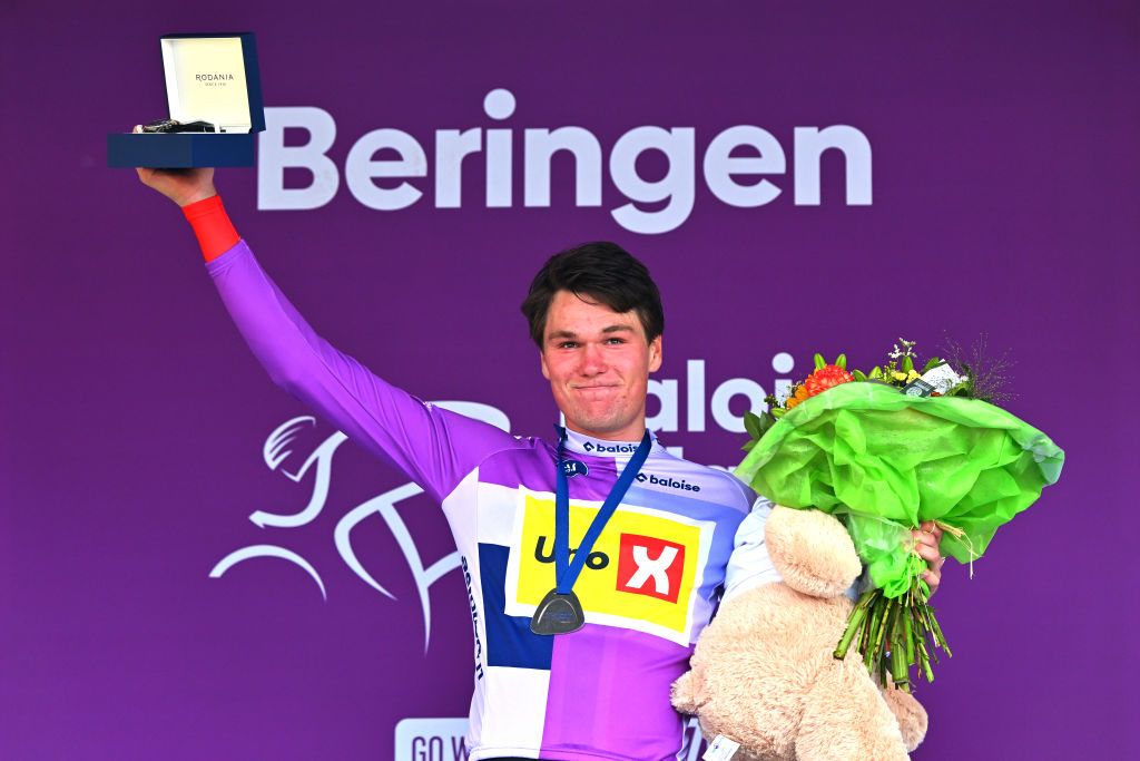 TURNHOUT BELGIUM JUNE 12 Soren Waerenskjold of Norway and Team UnoX Mobility celebrates at podium as Blue Leader Jersey winner during the 93rd Baloise Belgium Tour 2024 Stage 1 a 12km individual time trial stage from Beringen to Beringen on June 12 2024 in Beringen Belgium Photo by Luc ClaessenGetty Images
