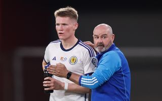 Steve Clarke in discussion with Scott McTominay during the Euro 2024 qualifier against Spain