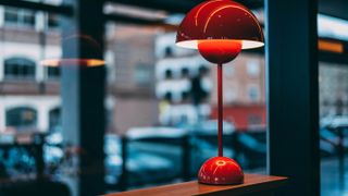 Red wireless lamp on table