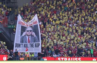 Fans of Liverpool protest rising ticket prices with posters that read 'Caution, Anfield's soul at risk' during the Premier League match between Liverpool and Crystal Palace at Anfield 
