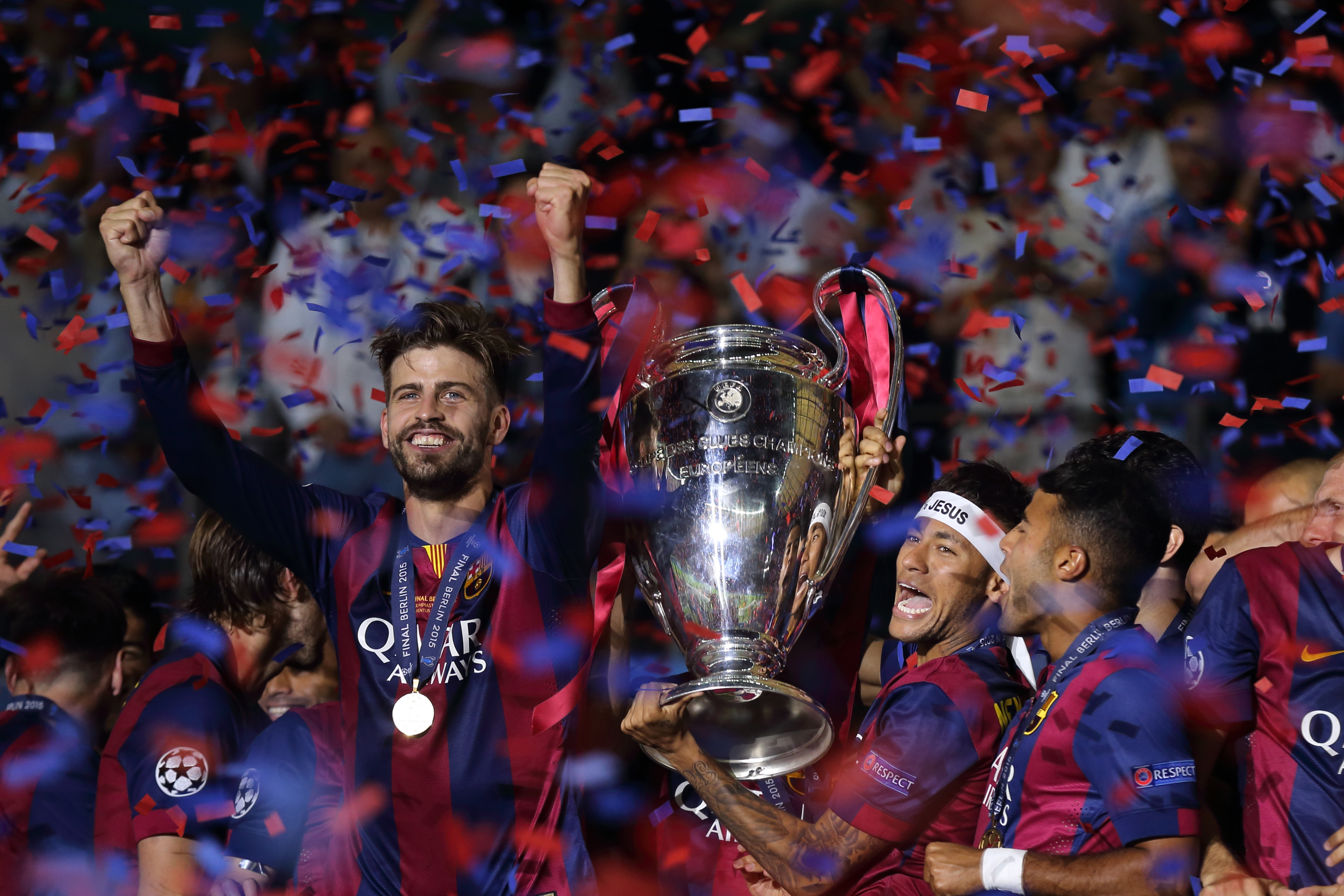 Gerard Pique and Neymar celebrate with the trophy after Barcelona's Champions League final win over Juventus in 2015.